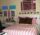 Pink bed with wall decor