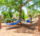 Blue and beige hammocks hanging from posts